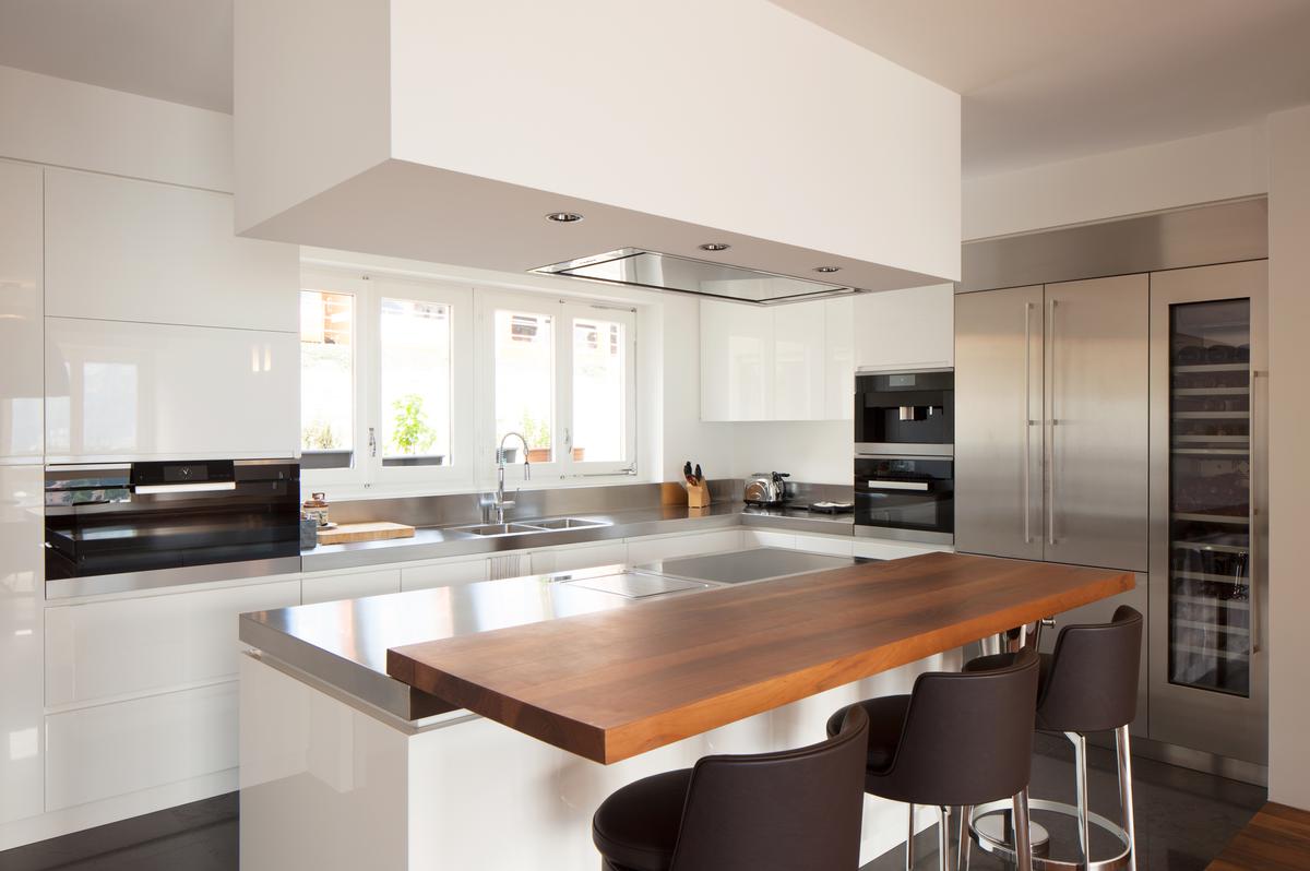 A minimalist kitchen design comes with an unlimited array of table choices.