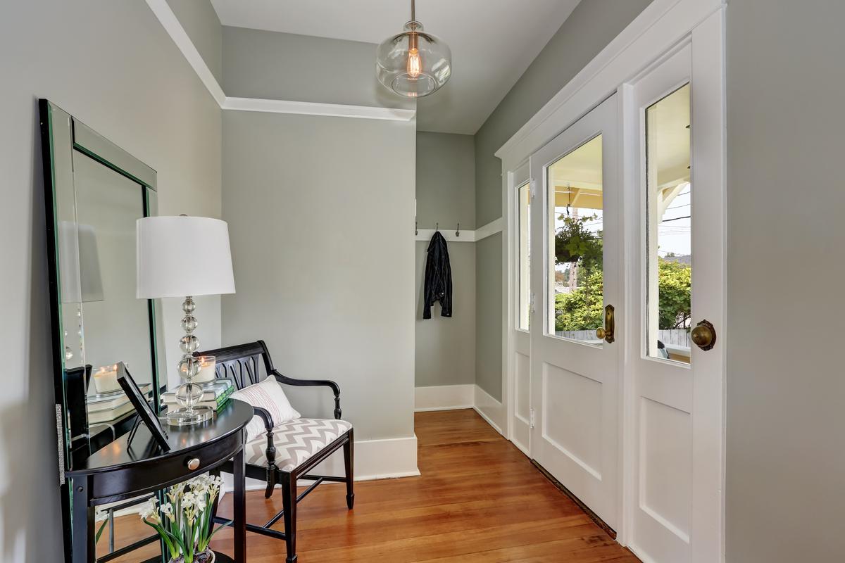 Elevate your gray foyer walls with natural light to maximize the aesthetic appeal.