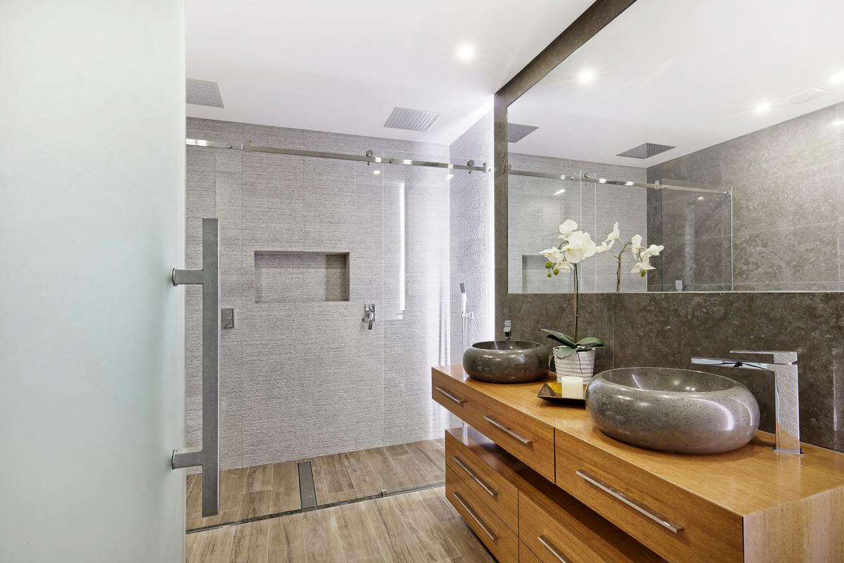 Wet rooms are the premier option for minimizing clutter and maximizing space in your bathroom.