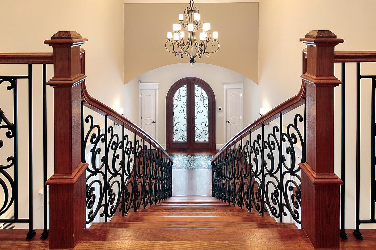 A wrought-iron chandelier is a brilliant way to add visual interest to your entryway.