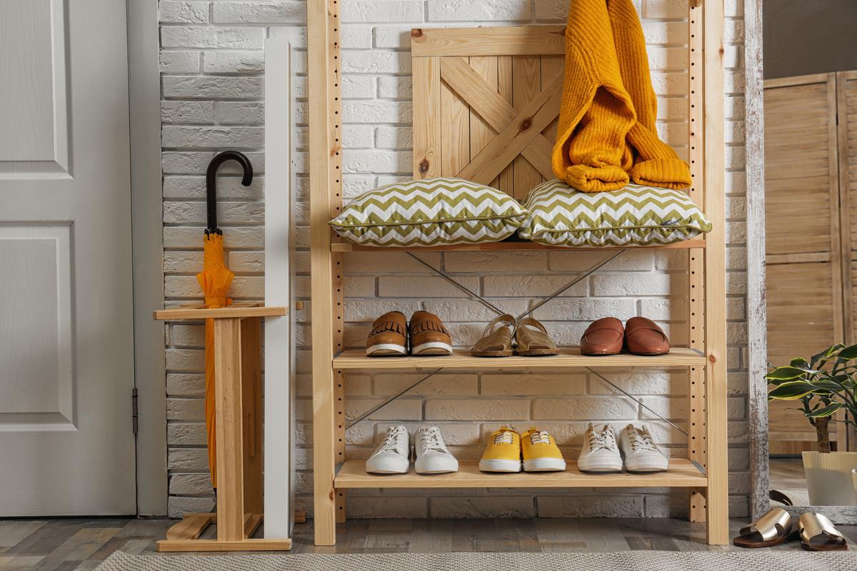 A wooden shelving unit for shoes can go well with a variety of interior design styles.