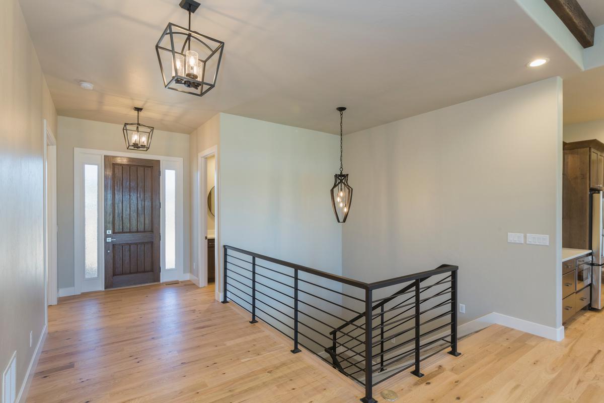 A modern farmhouse pendant is a trendy way to brighten up your foyer.