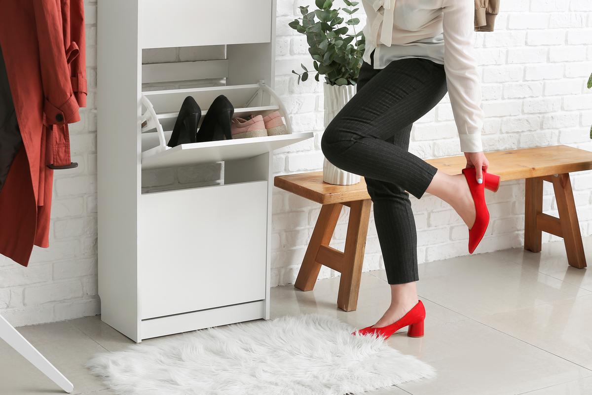 You can prevent your footwear from taking over the entryway with vertical shoe cabinets.