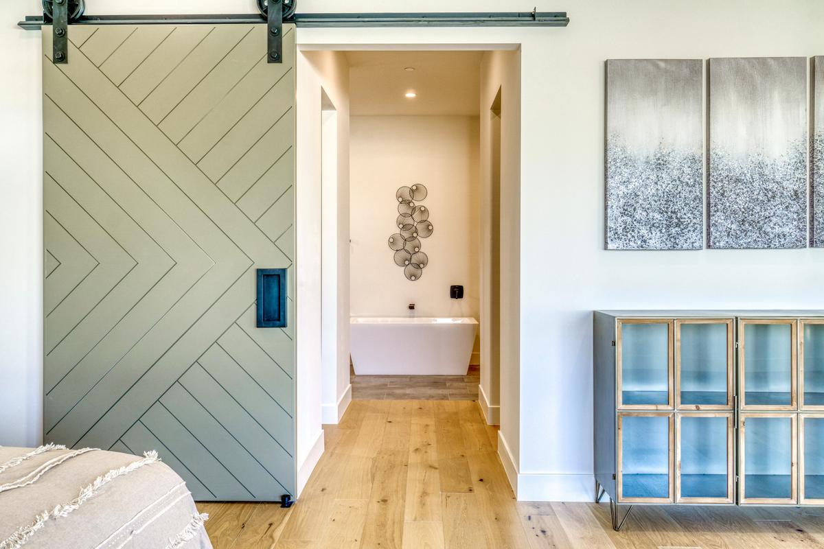 A stylish sliding door is a great way to make a strong first impression as you enter the bathroom.