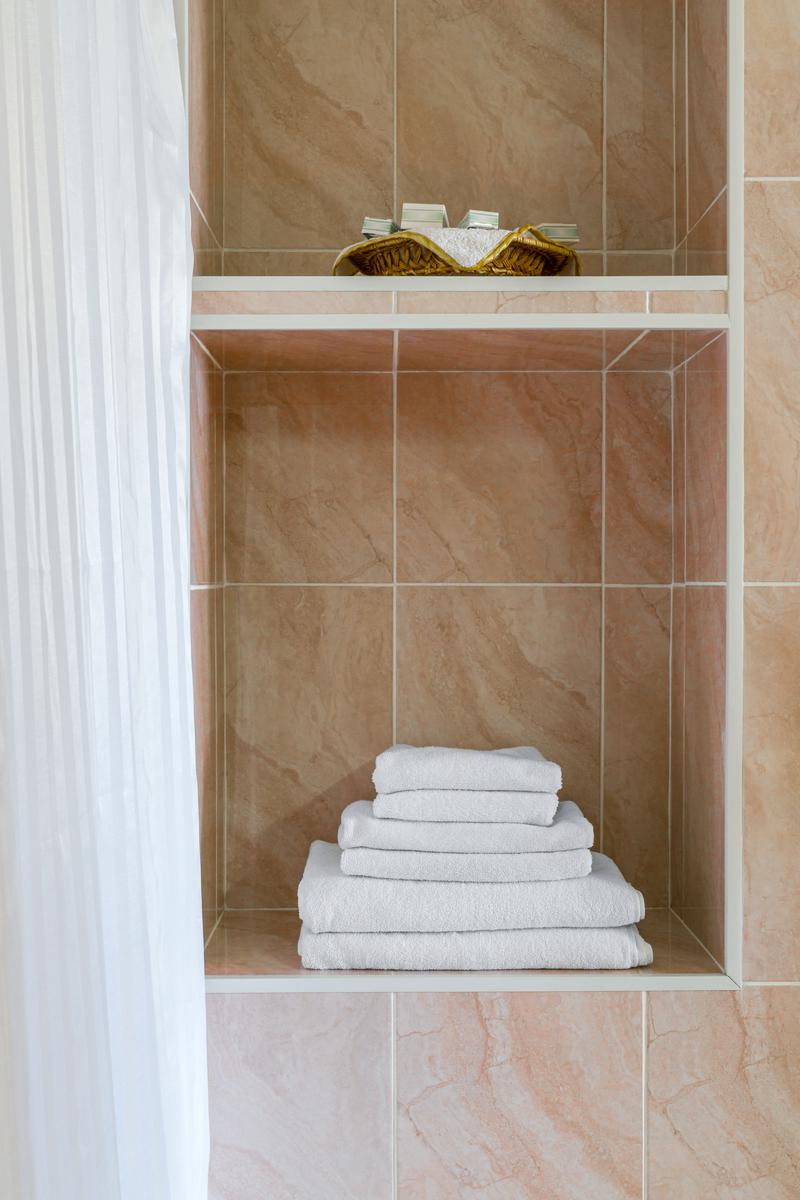 -A recess in the bathroom wall can serve as storage space for anything from towels to soap baskets.