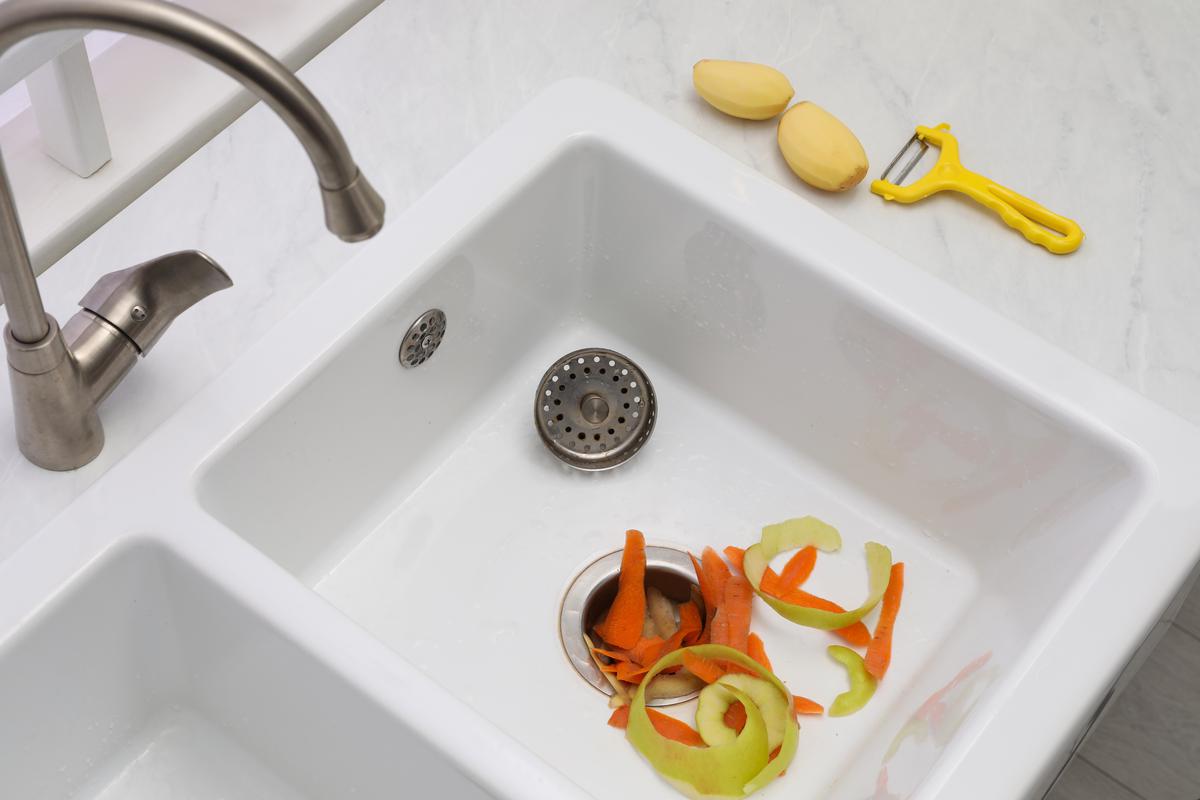 To prevent your garbage disposal from getting jammed, avoid draining food scraps such as potato peels.