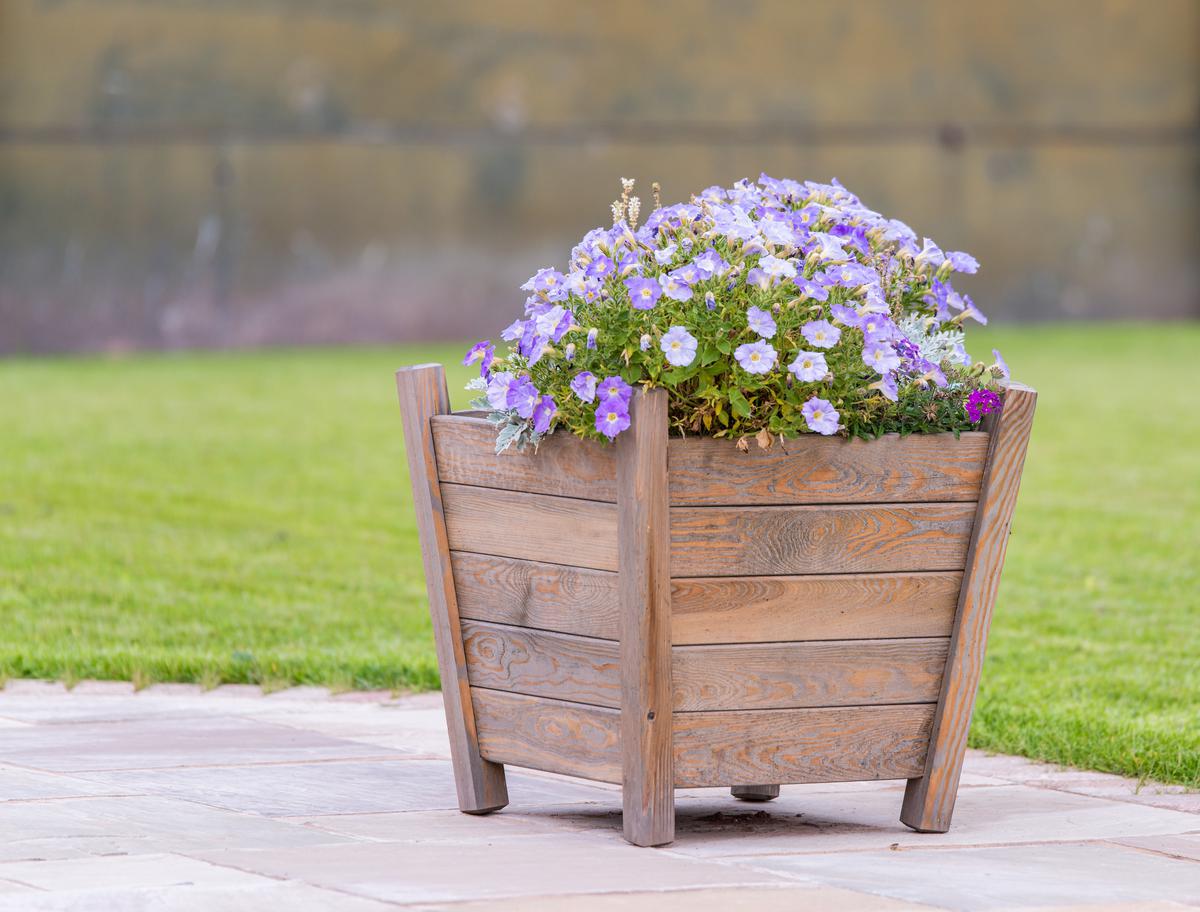 Consisting of just a few materials, wood planters aren't hard to craft at home.