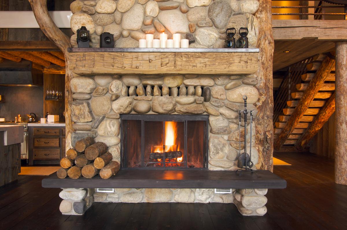 The fireplace usually serves as the focal point in a cabincore home.
