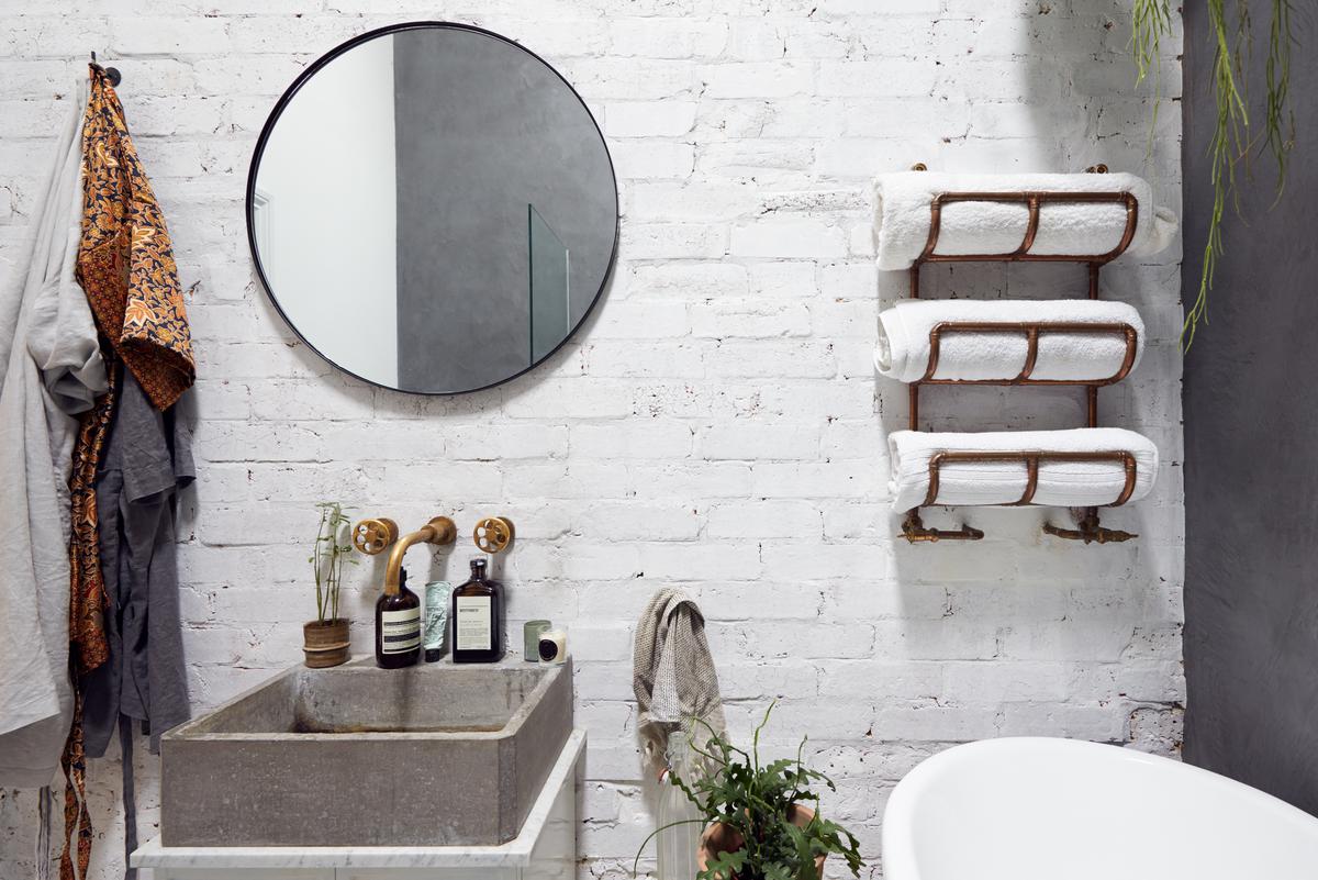 The raw aesthetic of concrete sinks makes them a great choice for industrial style bathrooms
