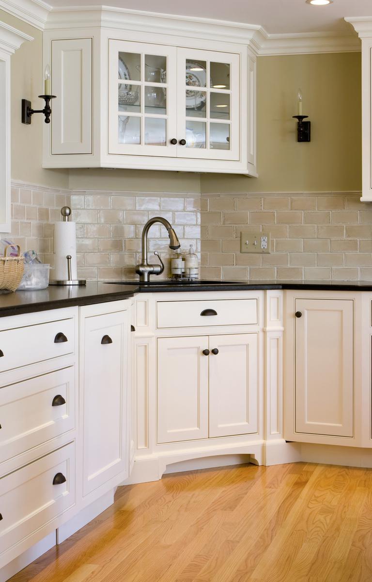 Corner sink cabinets are a perfect place to store cleaning supplies.