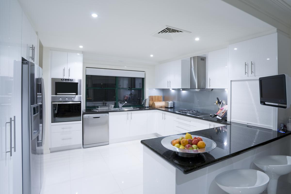 Installing Cabinets Can Help Clear Counter Space and Make Your Peninsula Kitchen Bigger