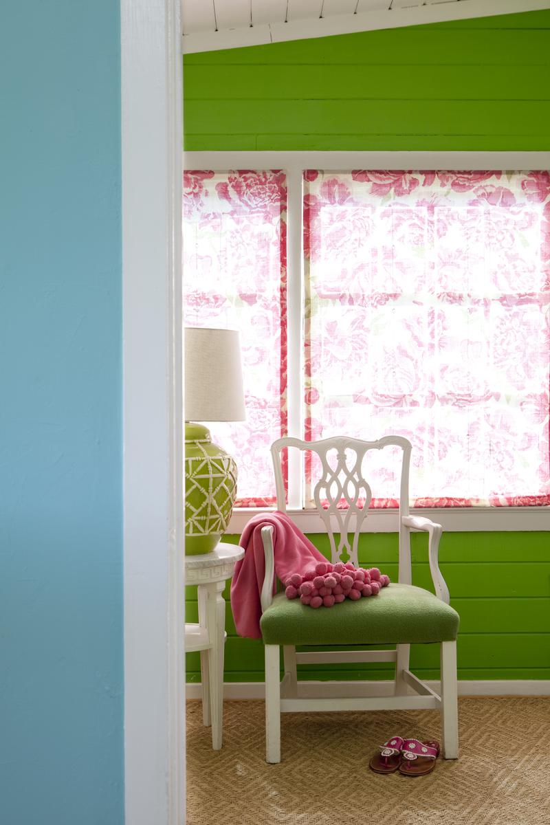 Teamed with bright accents, pops of blue and green create a unifying theme in the cottage-style home.