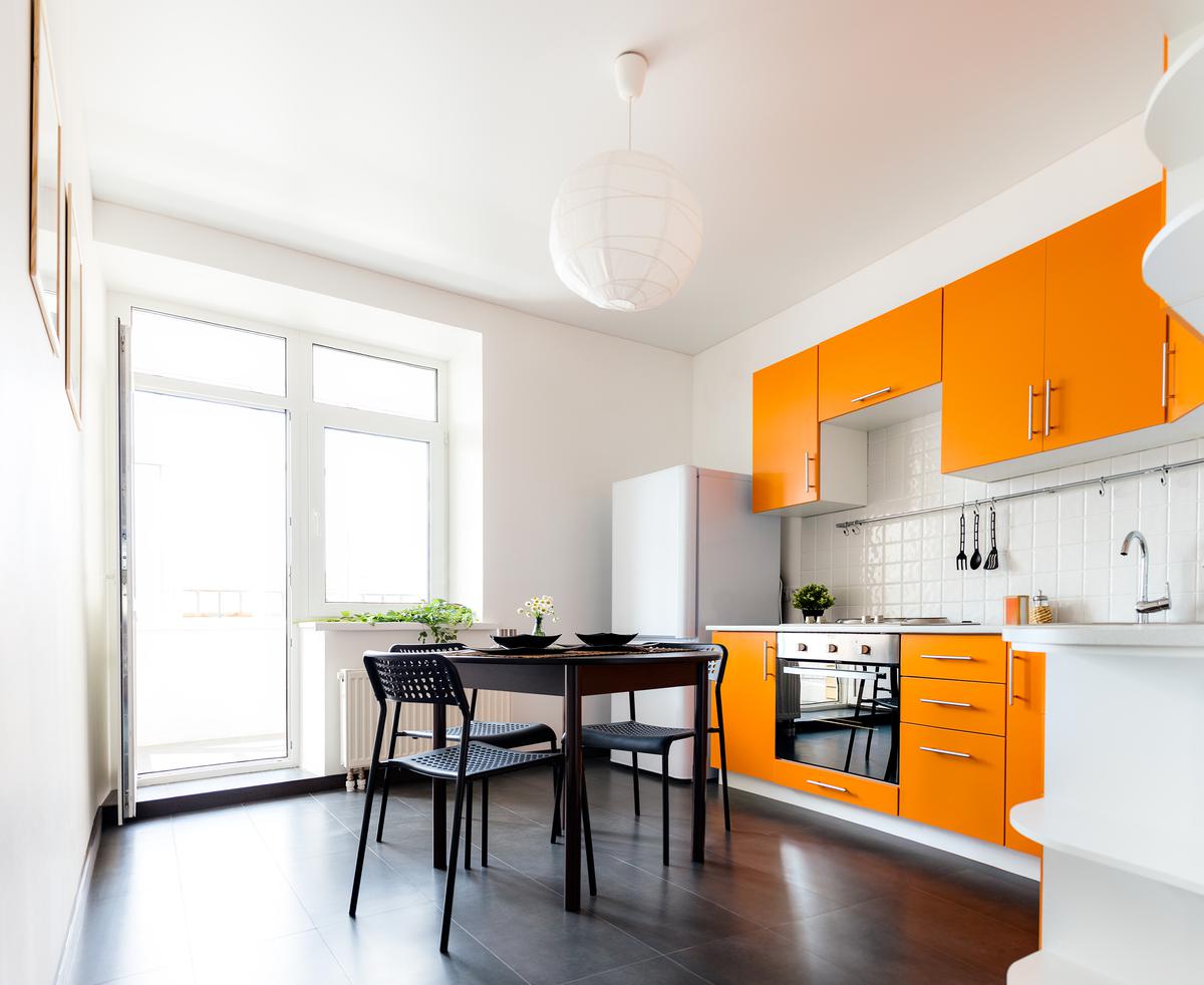 Lively orange kitchen countertops light up your kitchen.