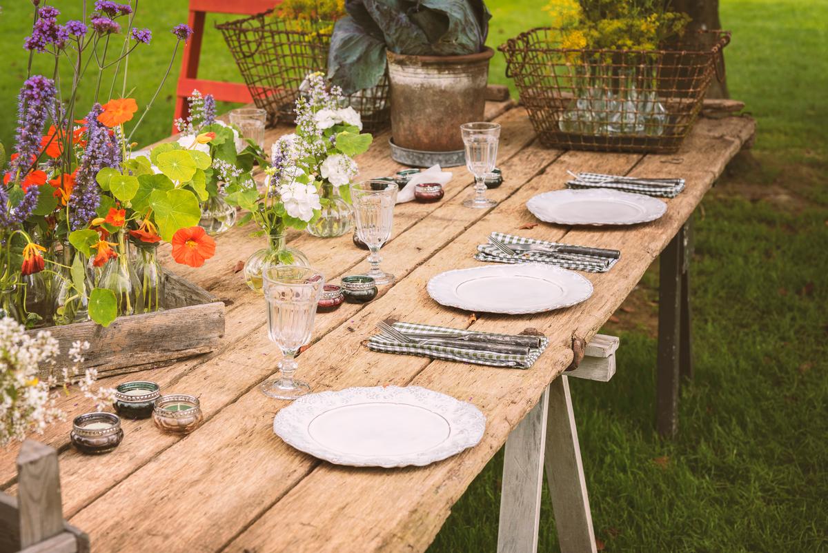 Embrace the beauty of reclaimed wood with this rustic garden table that not only looks beautiful but will be a nice addition for hosting guests.