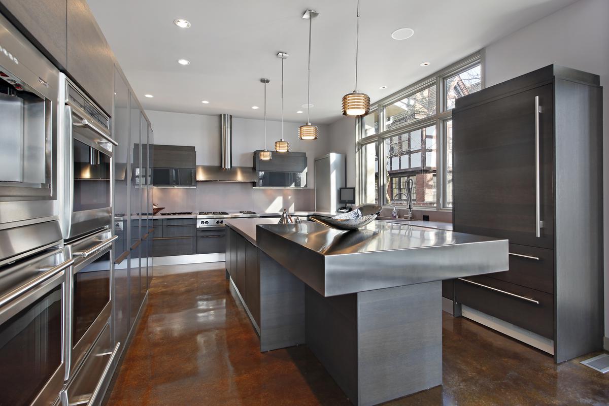 Stainless steel is an ideal material for backsplashes and kitchen appliances thanks to its durability.