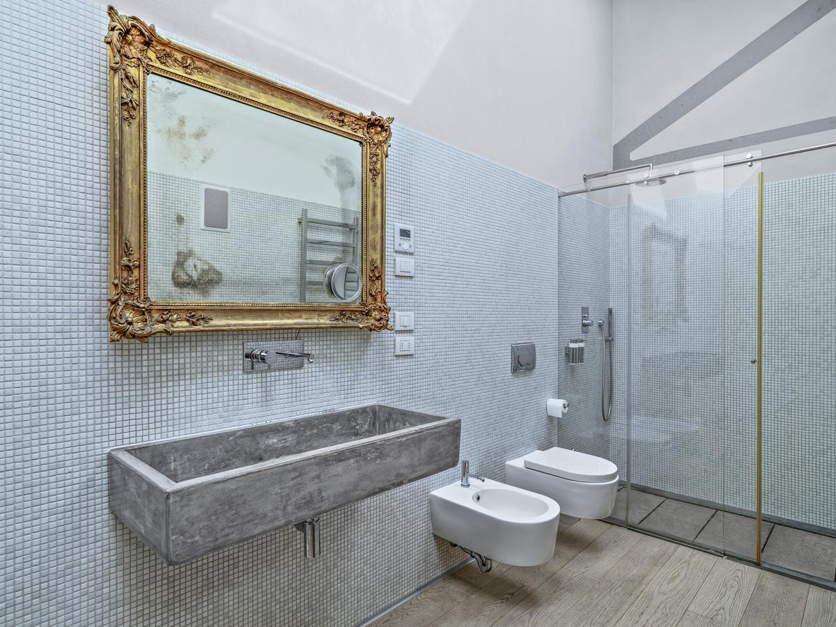 Subtle Gold Accenting Make For a Glitzy Bathroom Spa