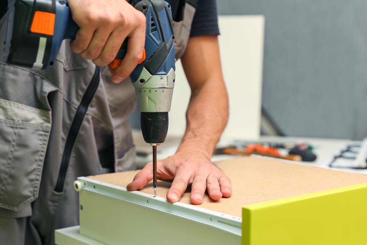 The drawer’s hardware allows it to fit into the cabinet.