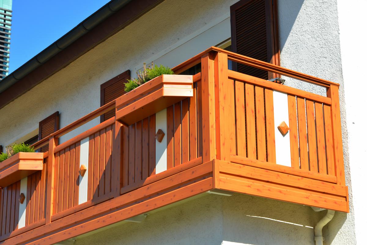 Wooden Panels Are a Great Balcony Option Especially When Paired With White Stucco Walls