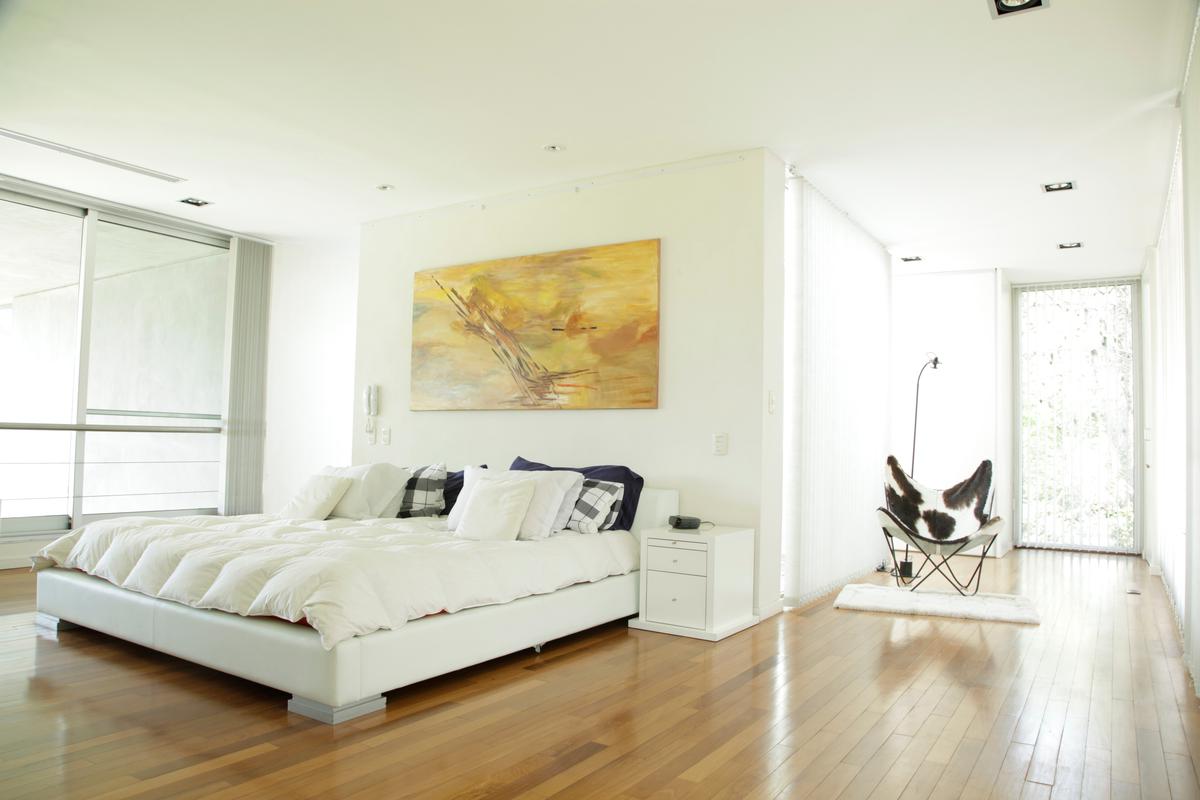 You can highlight your bed as the focal point of your bedroom with a splash of art.
