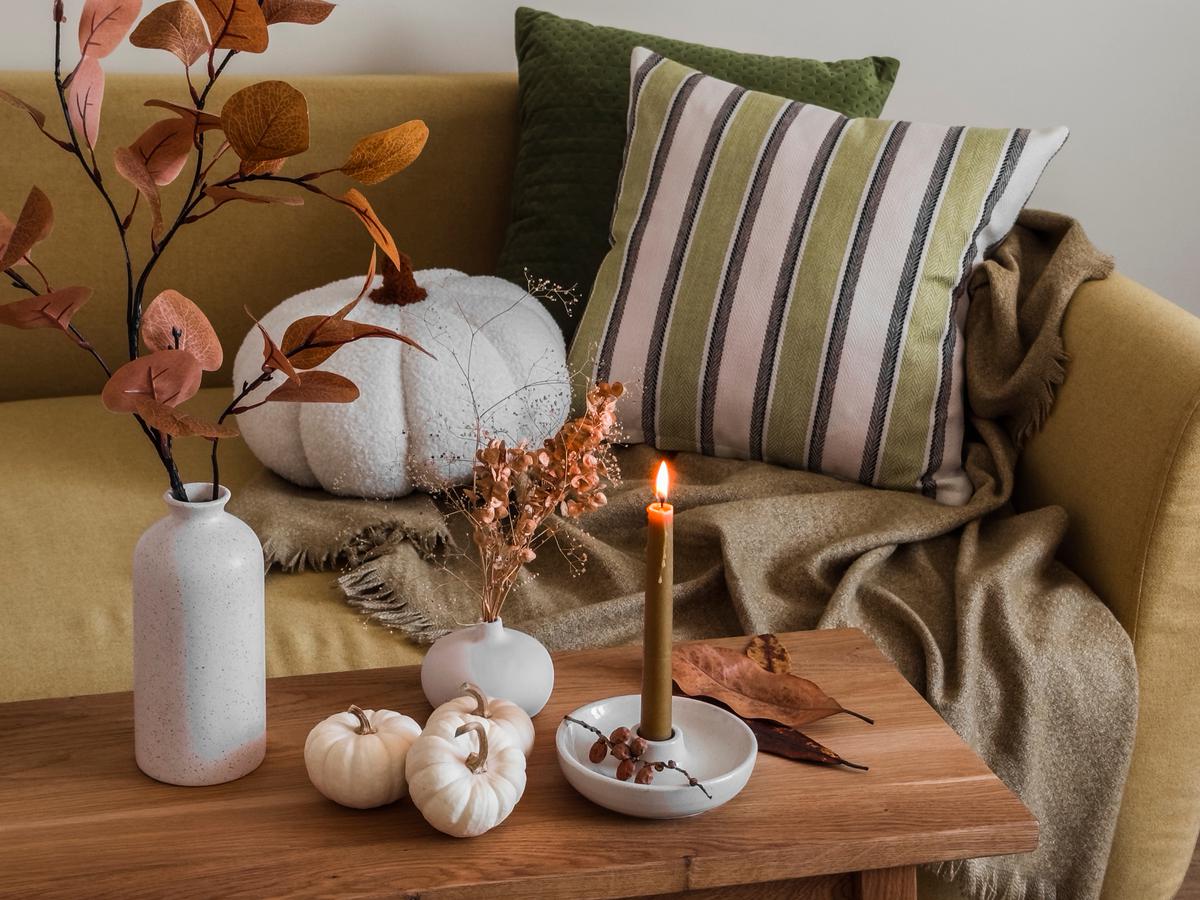 Embracing autumn's warmth with cozy fall house decorations.