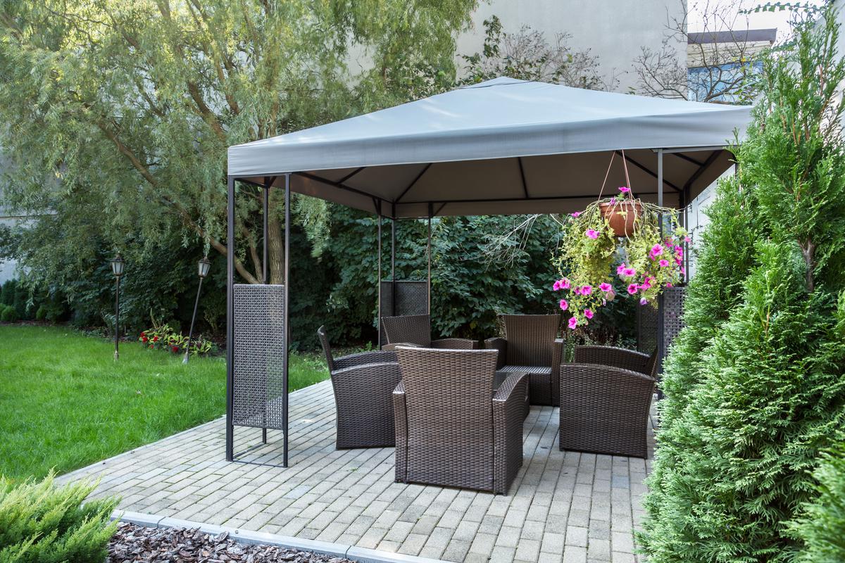 Optimize a newly built gazebo with cost-effective, multipurpose furnishings like storage benches, adopting a gradual approach to add pieces that resonate with your style and functionality needs over time.