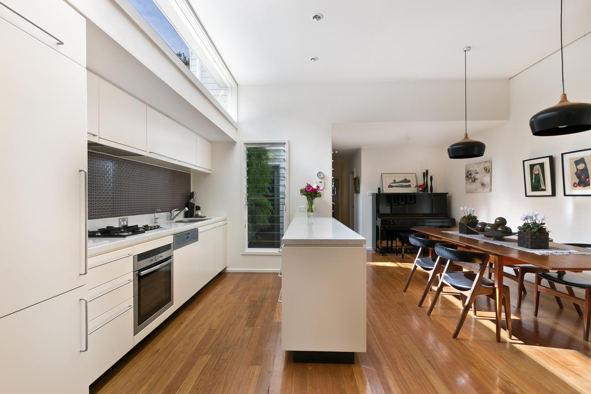minimalist kitchen with wooden table