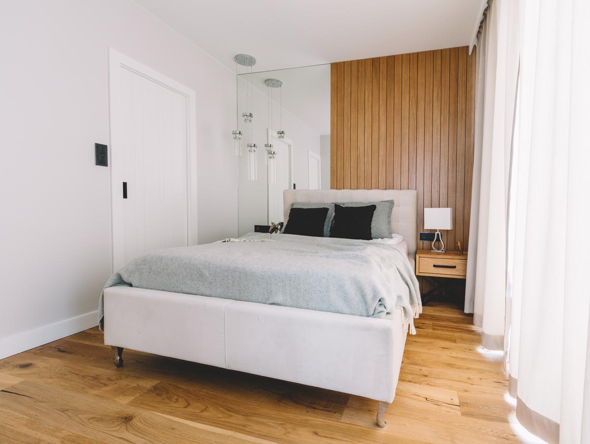 Lighter colors and mirrors maximize reflectivity, thereby keeping a small space from feeling cramped.