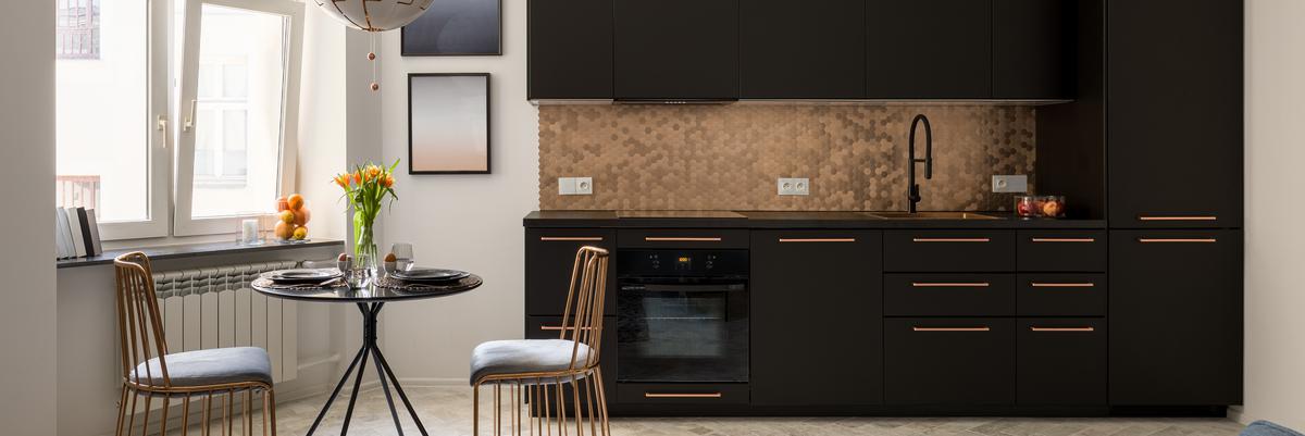 moody kitchen with natural stone