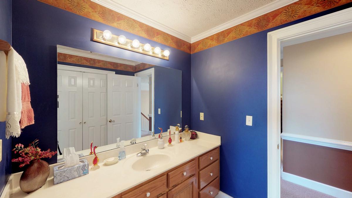 Installing spotlight bulbs around a mirror allows you to pair glamor with practicality.