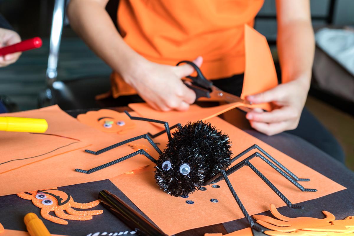 Get your kids involved with some DIY arts and crafts spiders to watch over your house on Halloween.