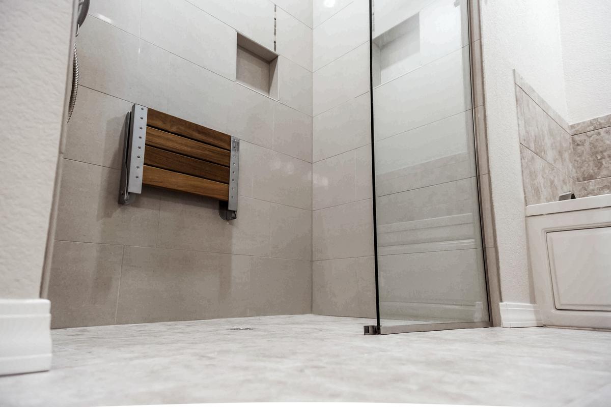 Incorporate innovative design elements in your walk-in shower to enhance functionality and style in your small bathroom.